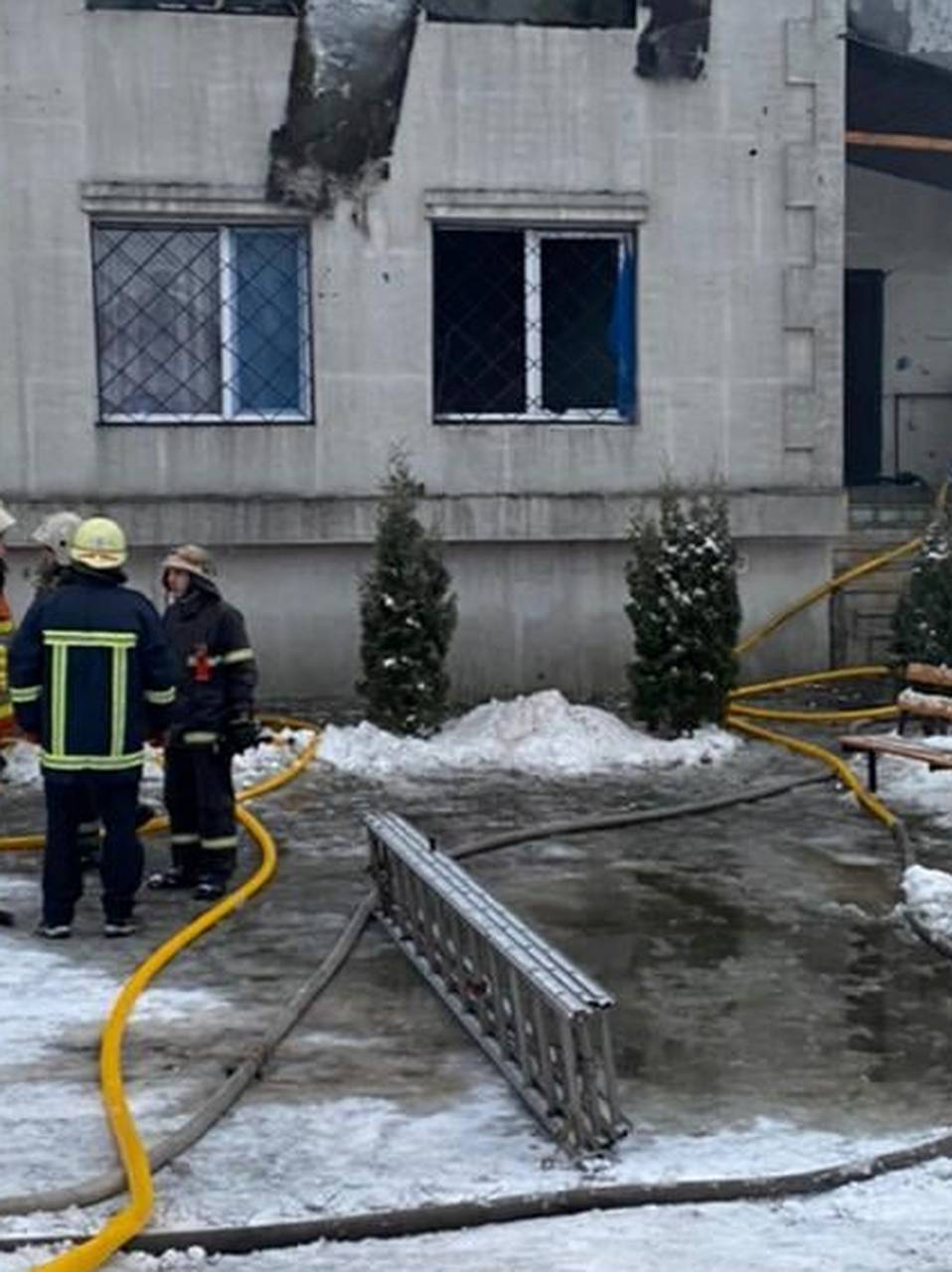 Rescuers work at the scene of the accident following a fire in nursing home in Kharkiv