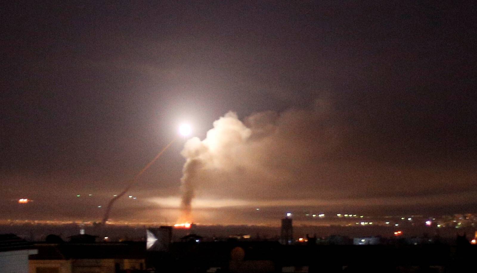 FILE PHOTO: Missile fire is seen from Damascus