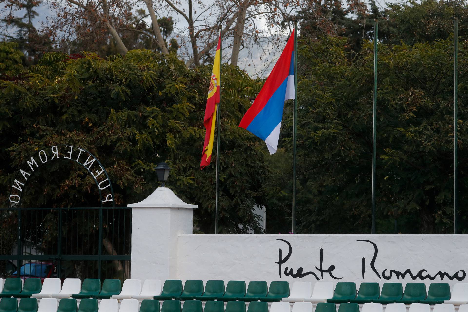 Flags of Serbia and Spain are seen at the Puente Romano Tennis Club in Marbella