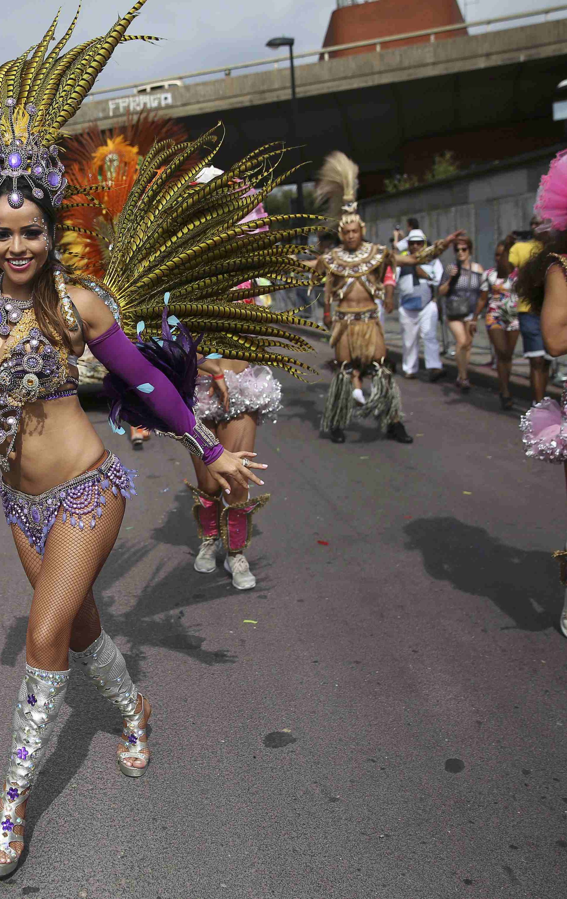 Performers participate in the parade at the Notting Hill Carnival in London