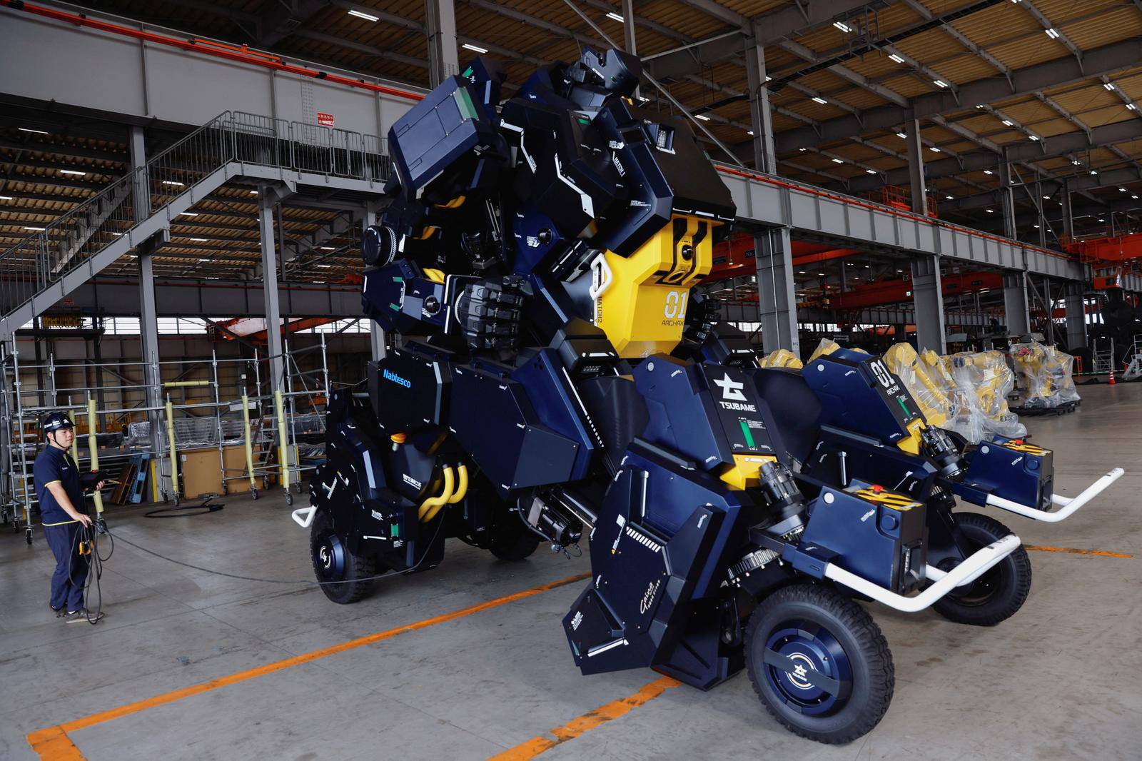 CEO Ryo Yoshida and CTO Akinori Ishii ARCHAX, a giant human-piloted robot, in Yokohama, Japan