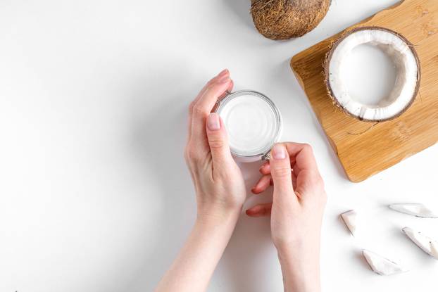 organic cosmetics with coconut on white background top view mockup