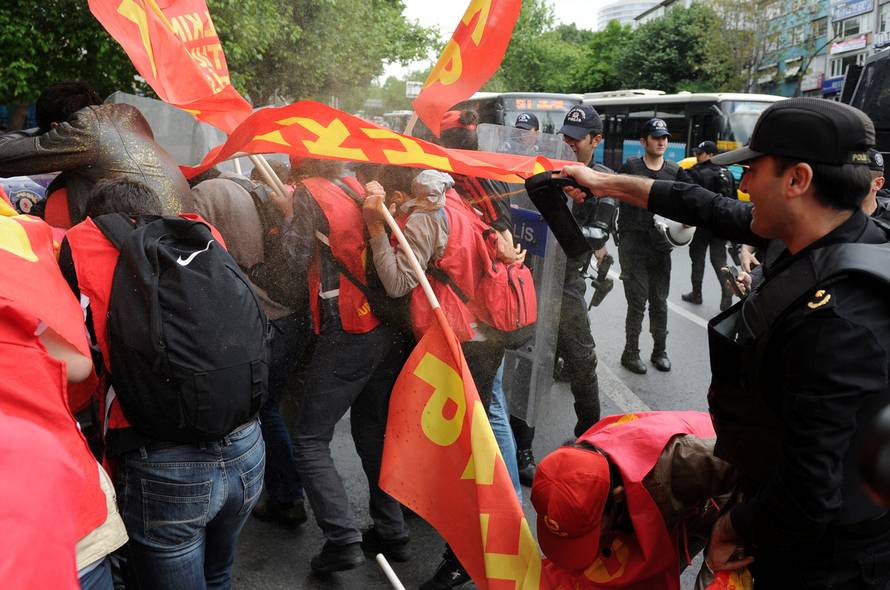 Turkish riot police use pepper spray against protesters as they attempted to defy a ban and march on Taksim Square to celebrate May Day, in Besiktas neighbourhood of Istanbul