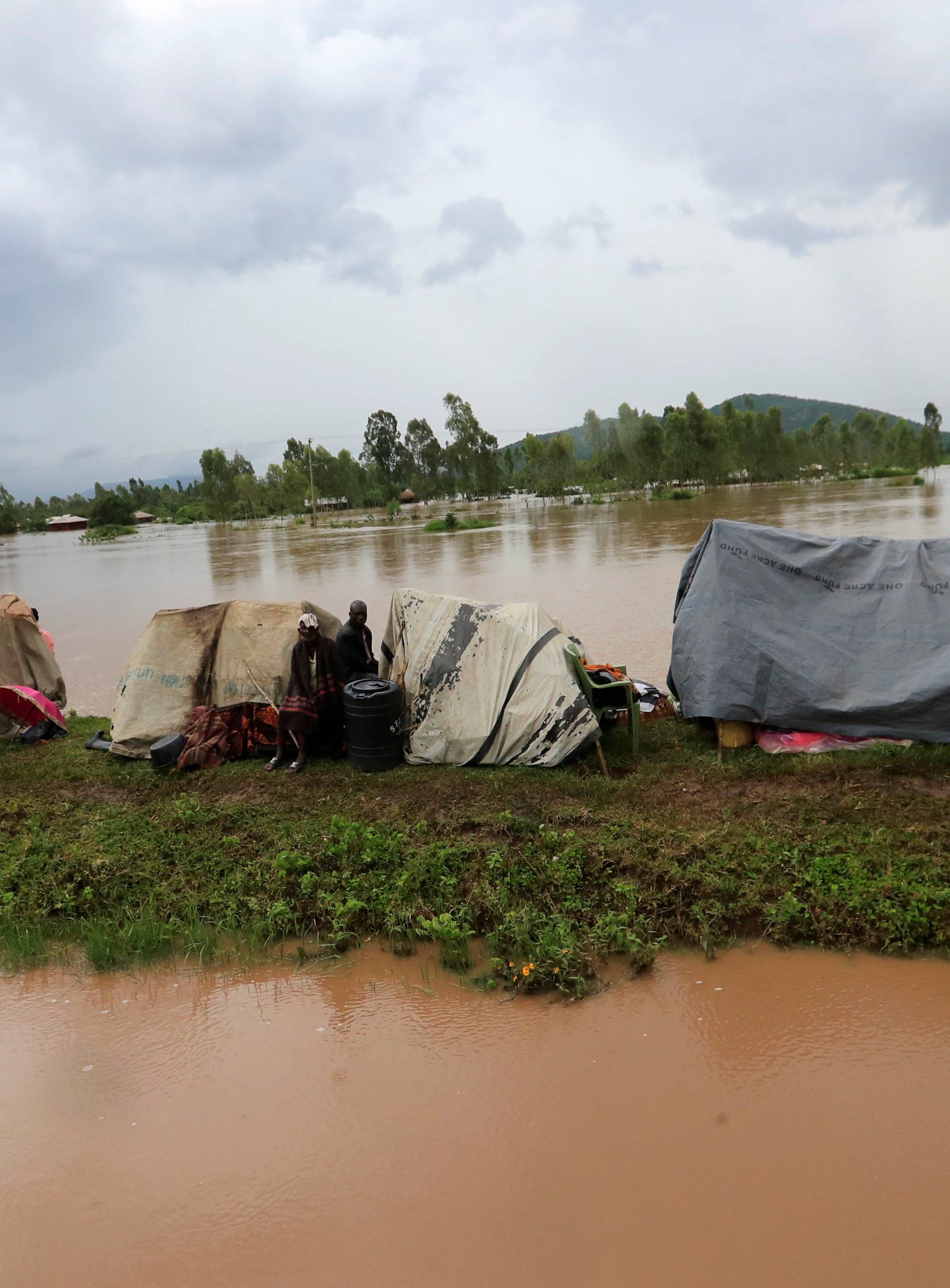 Residents set up makeshift shelter on a raised ground after they evacuated from their homes after River Nzoia burst its banks and due to the backflow from Lake Victoria