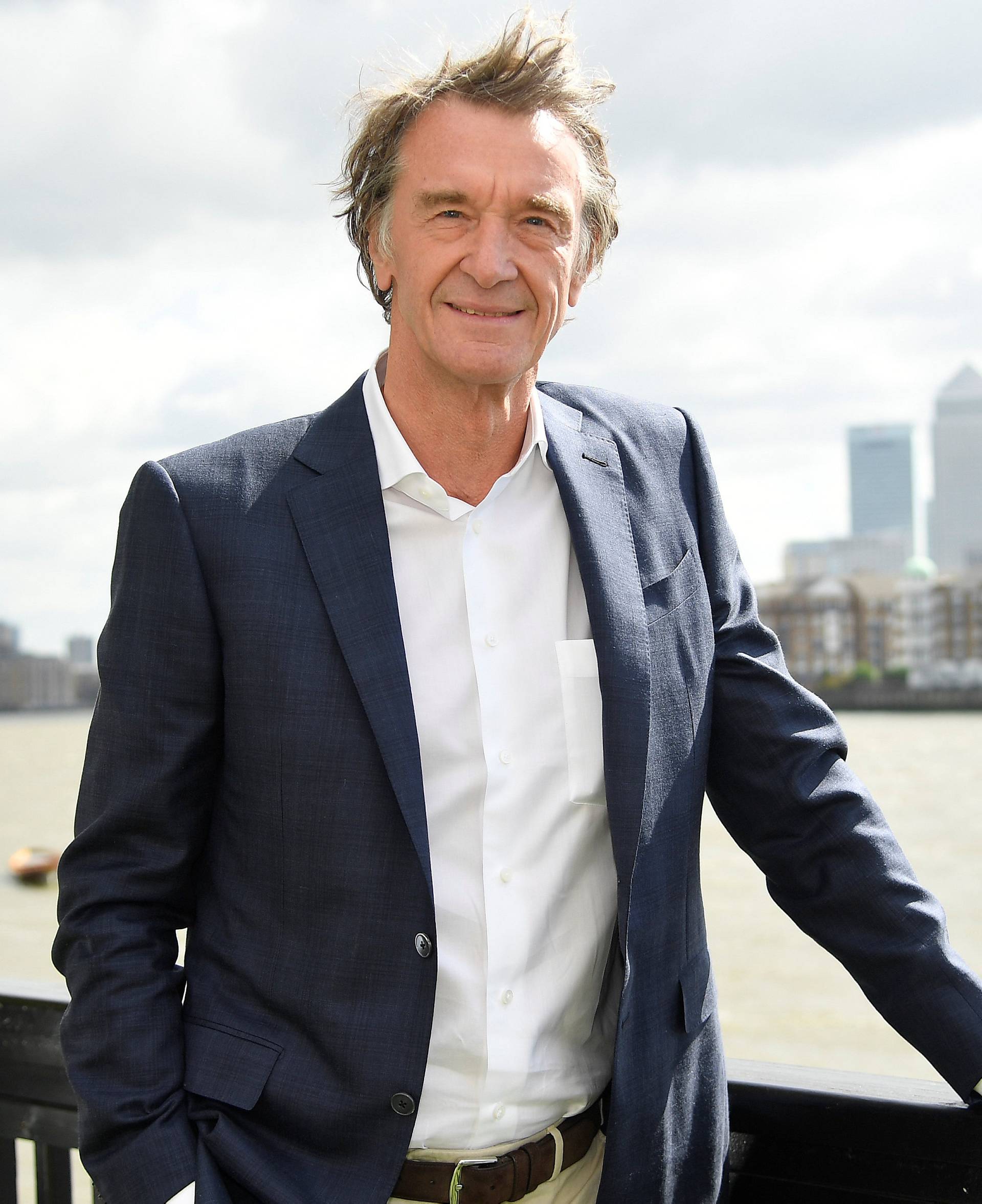 Ratcliffe, CEO of British petrochemicals company INEOS, poses for a portrait with the Canary Wharf financial district seen behind, ahead of a news conference announcing the launch of a British America's Cup sailing team in London, Britain