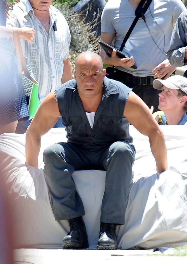 Vin Diesel is an action hero on the set of "Fast and Furious 7"