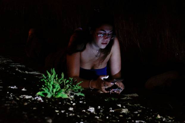 Rockets fly in the sky, amid cross-border hostilities between Hezbollah and Israel, as seen from Tel Aviv