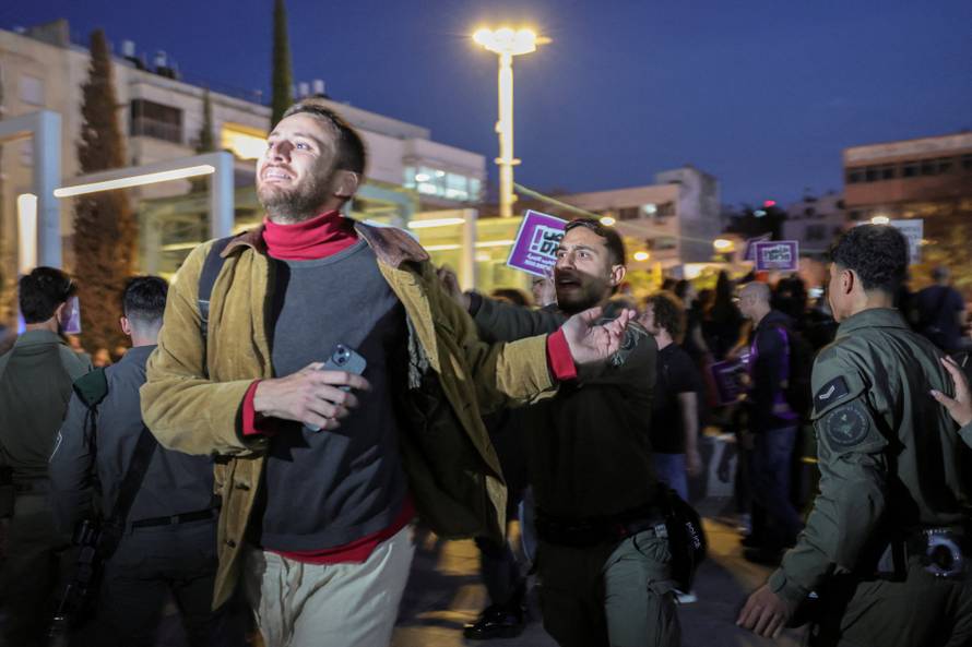 Demonstrators gather during an anti-war protest at Habima Square, in Tel Aviv