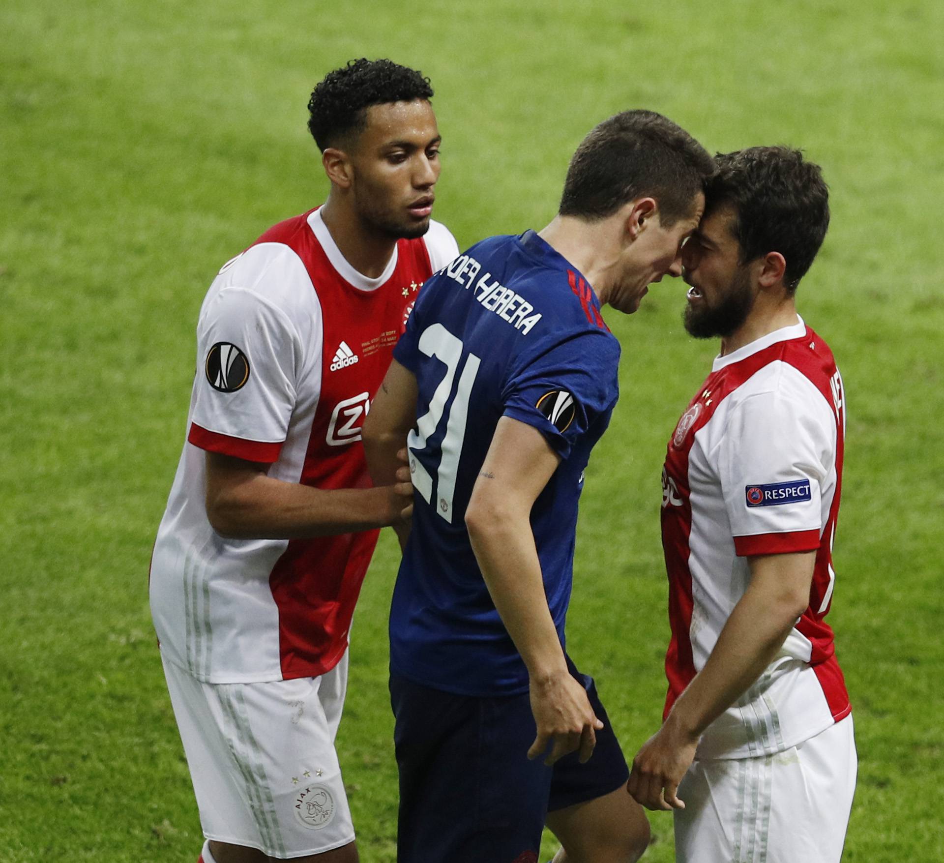 Manchester United's Ander Herrera squares up to Ajax's Amin Younes
