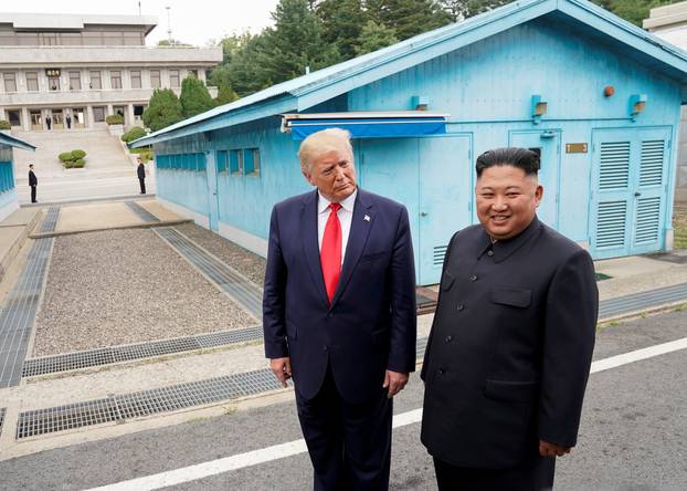 FILE PHOTO: Trump meets with North Korean leader Kim Jong Un at the DMZ on the border of North and South Korea