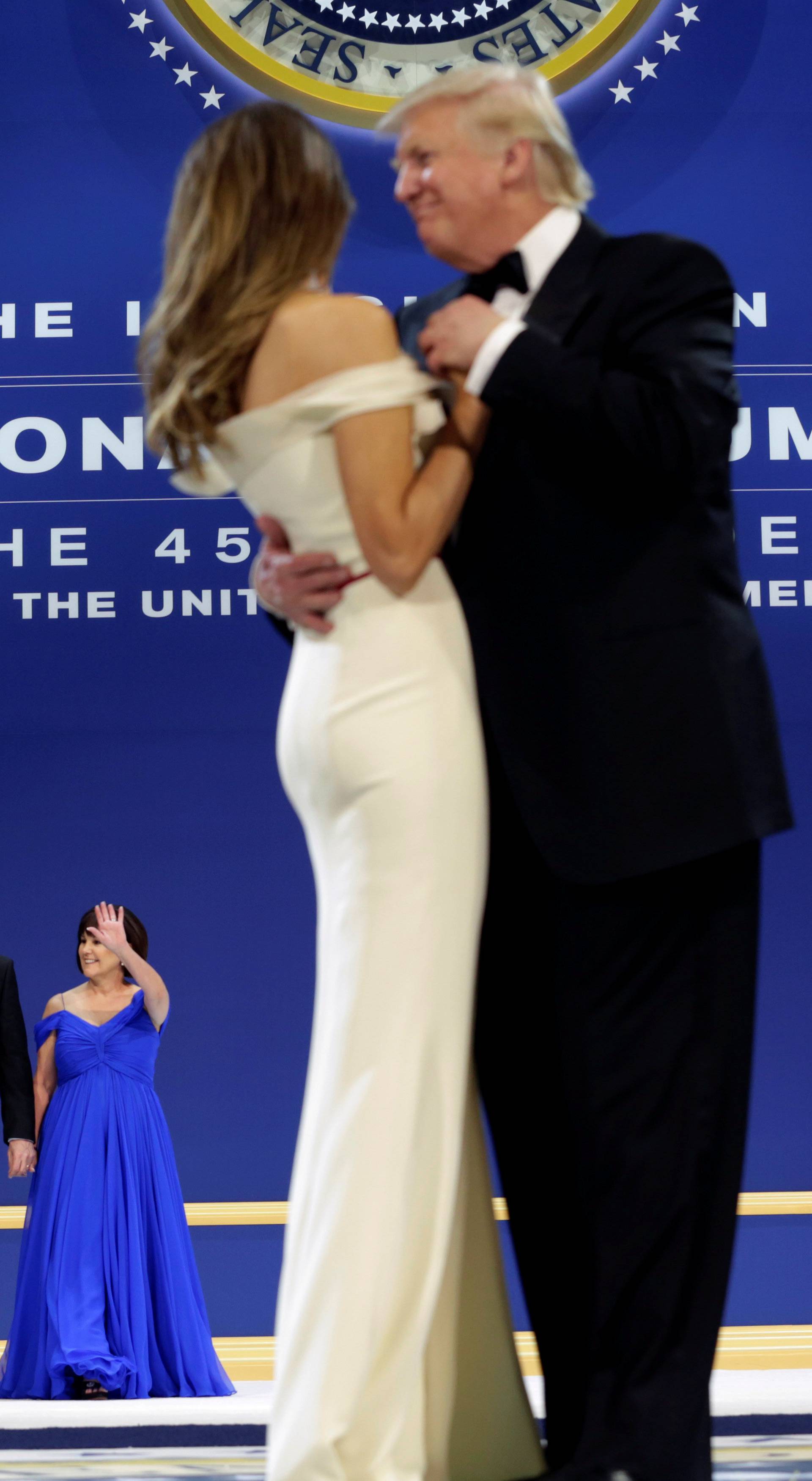 President Donald Trump with his wife Melania and Vice President Mike Pence with his wife Karen dance at the Armed Services Ball