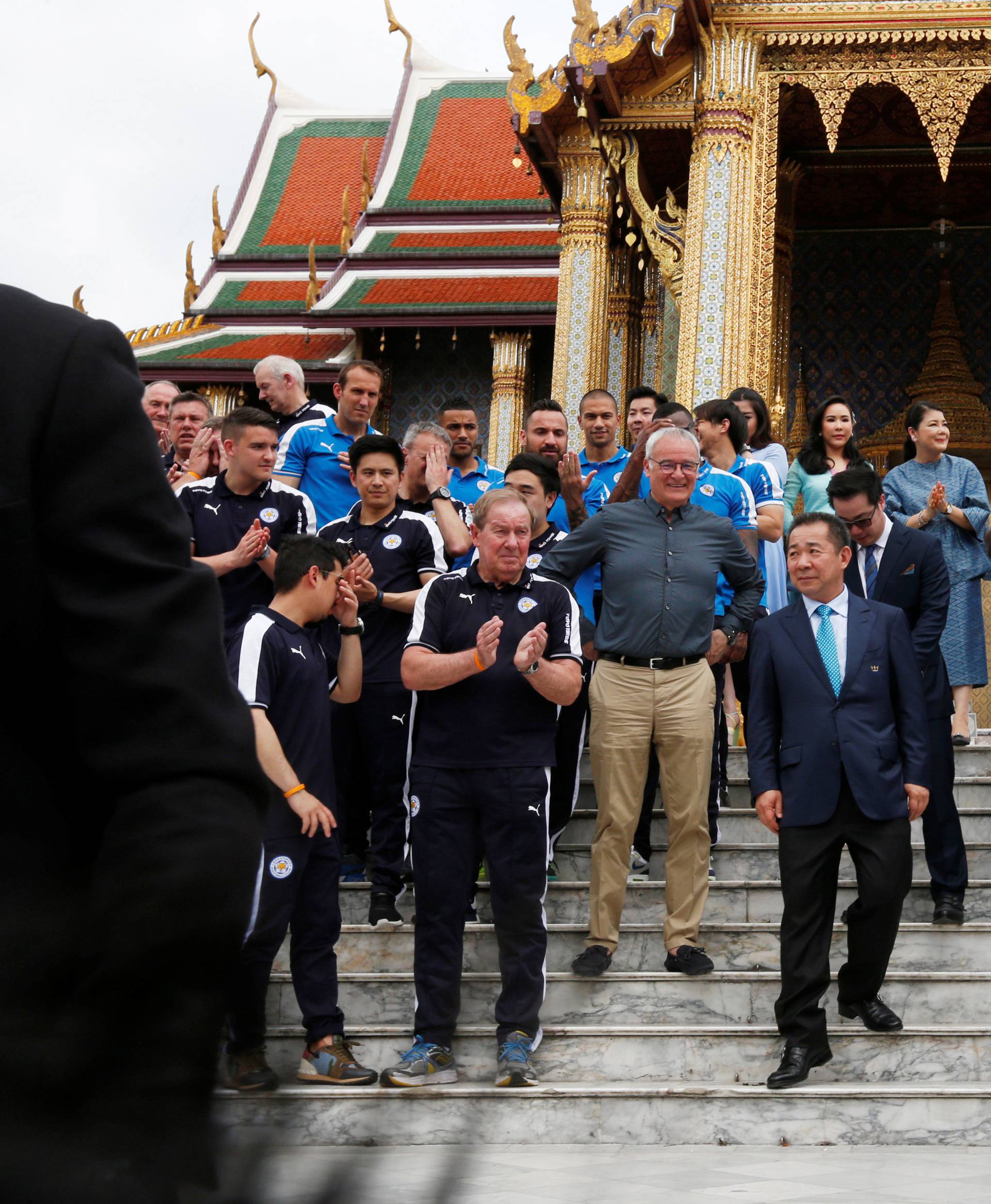 Leicester City soccer team poses for a while as they visit the Emerald Buddha temple in Bangkok