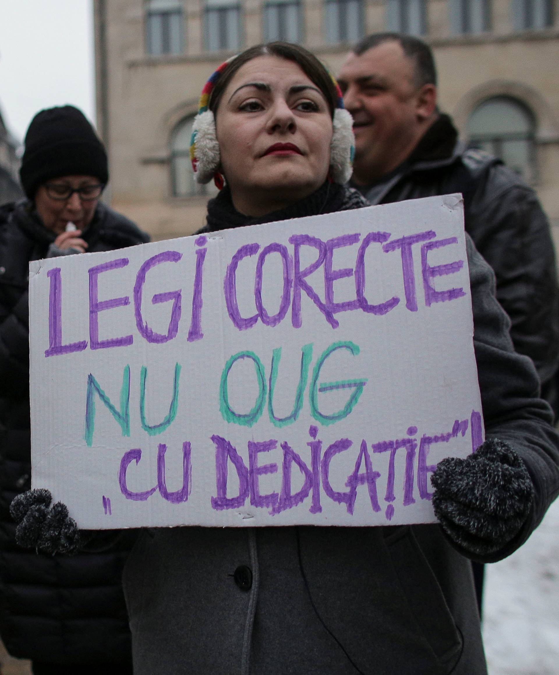 People take part in a demonstration to protest against government plans to reform some criminal laws through emergency decree, in Bucharest