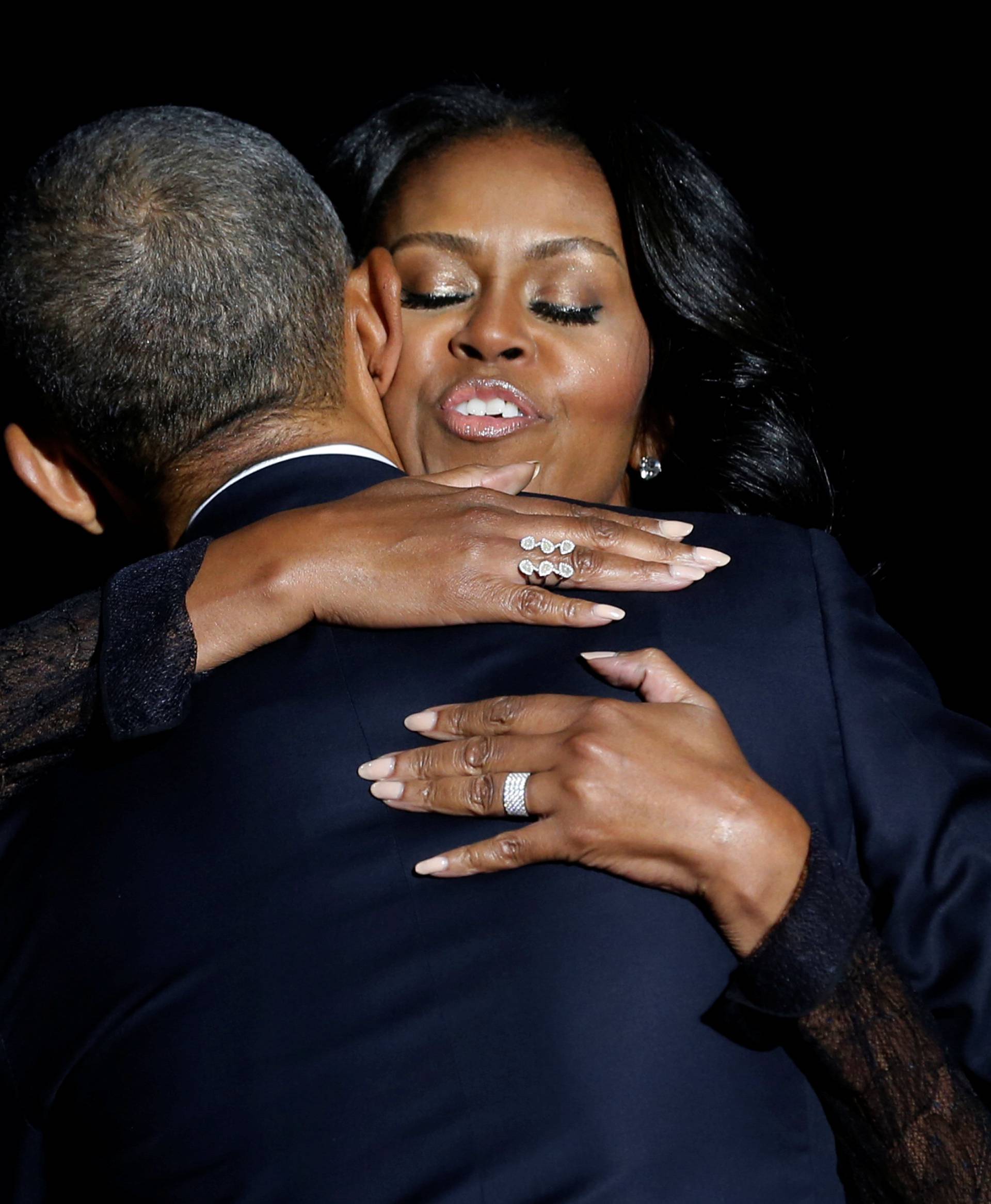 Obama embraces his wife Michelle Obama after his farewell address in Chicago