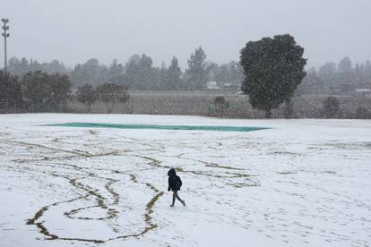 A child plays in the snow at Laerskool Orion, a school located in Brackenhurst