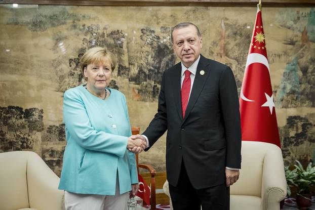 German Chancellor Merkel meets Turkish President Erdogan during the G20 Summit in Hangzhou