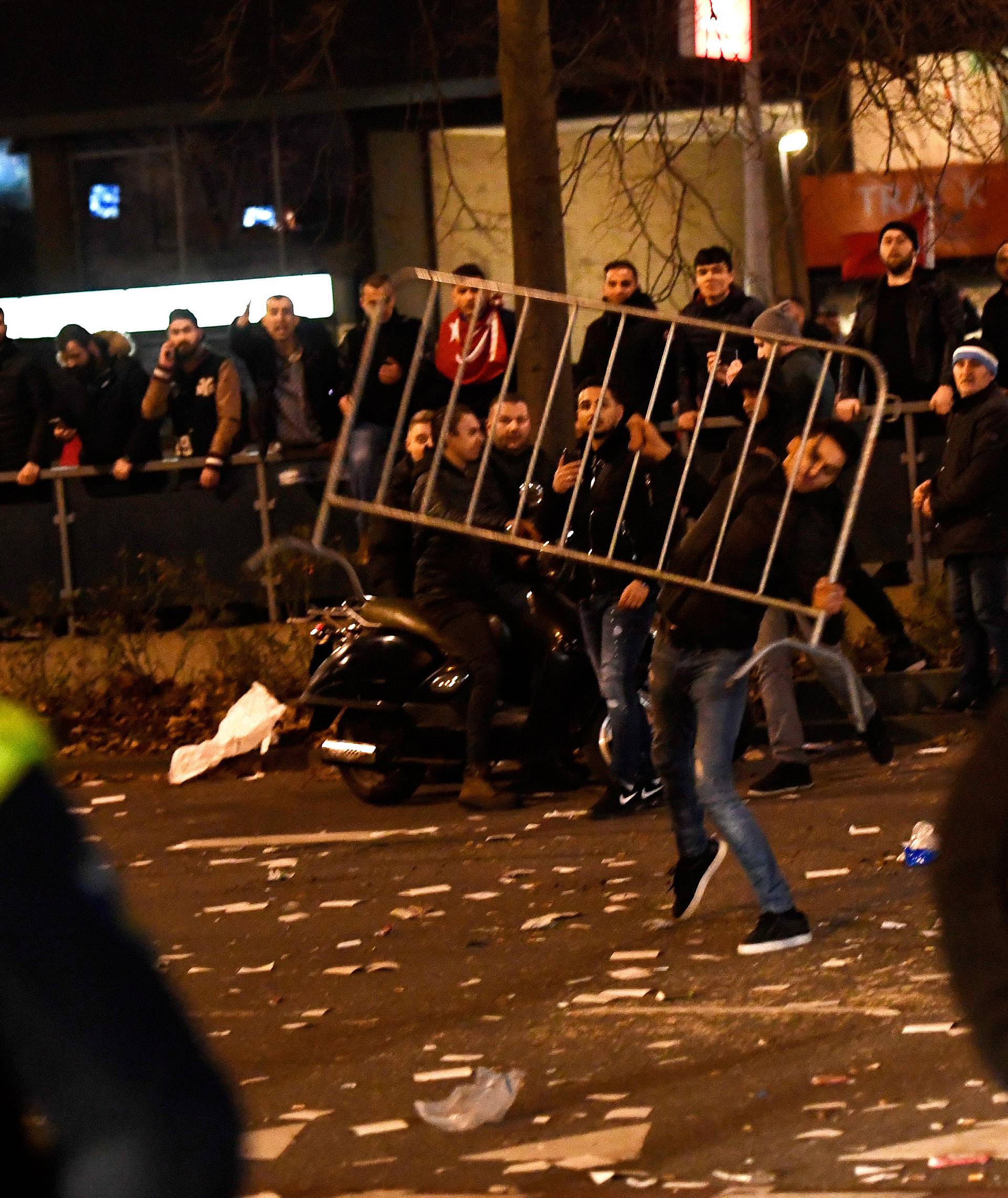 Riot police clash with demonstrators in the streets near the Turkish consulate in Rotterdam