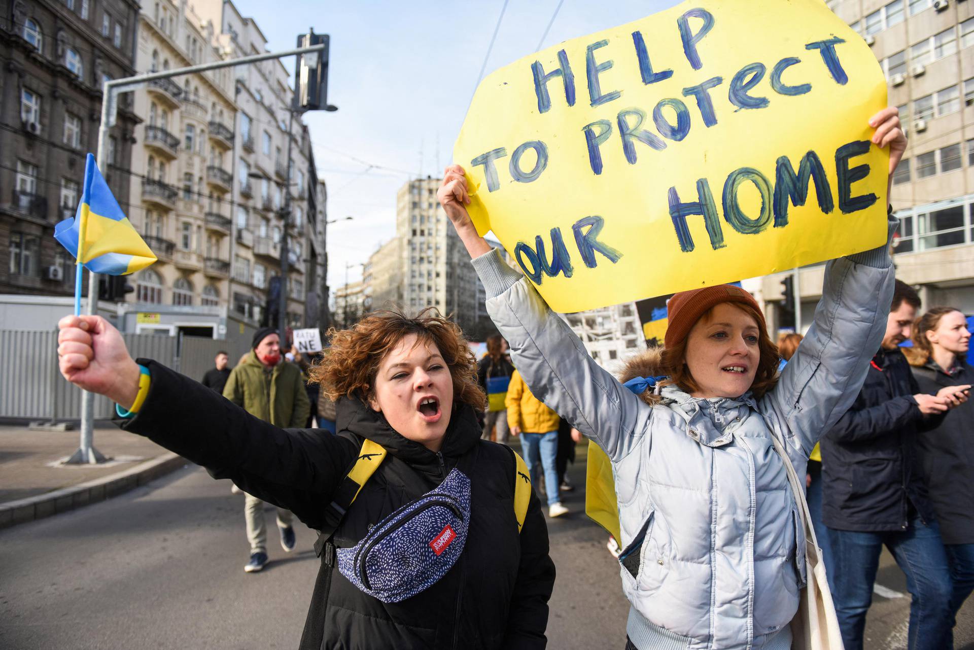 People take part in an anti-war protest, following Russia's invasion of Ukraine, in Belgrade