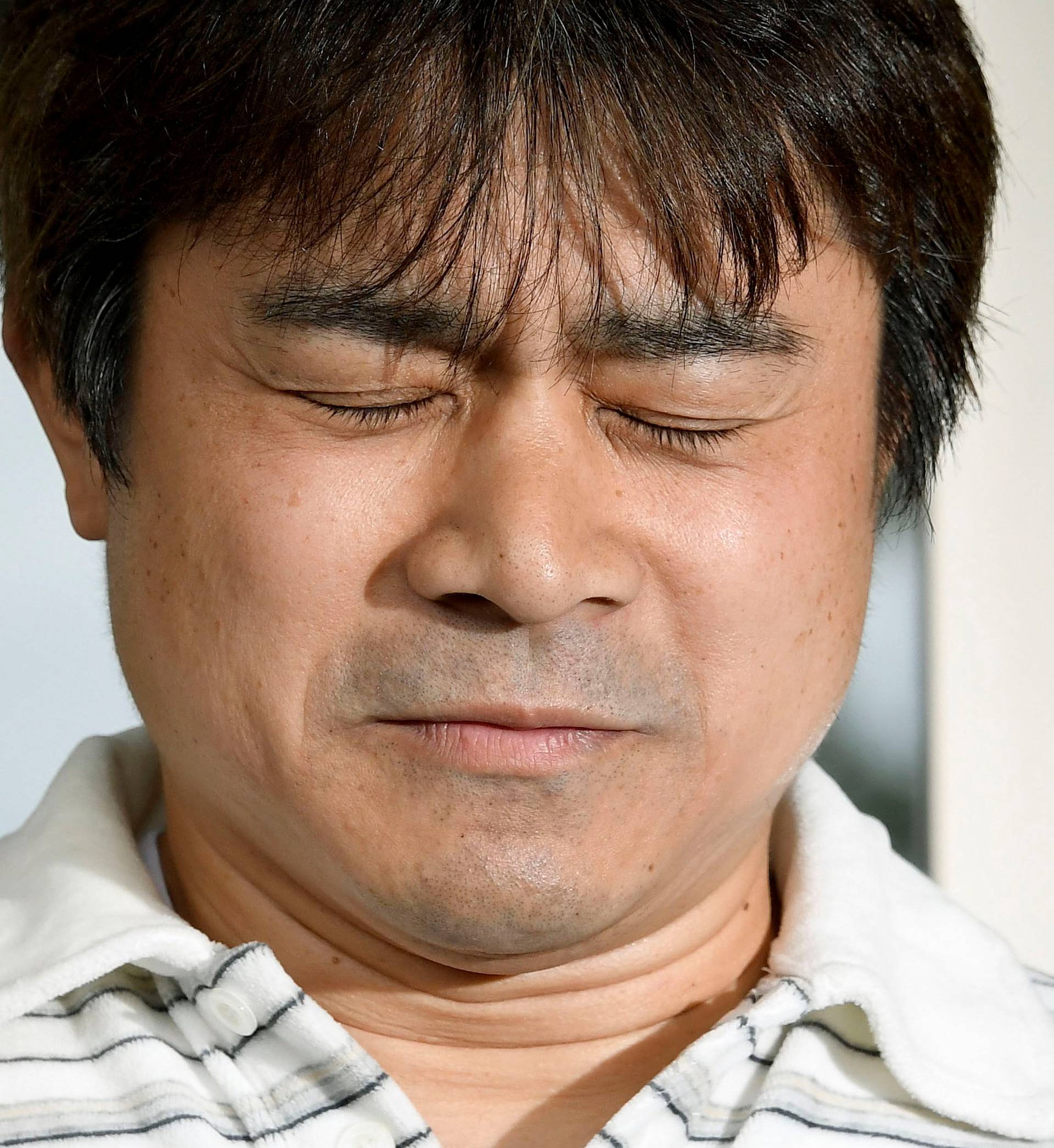 Takayuki Tanooka, father of 7-year-old boy Yamato Tanooka  who went missing on May 28, 2016 after being left behind by his parents, was found alive, reacts as he speaks to the media in Hakodate