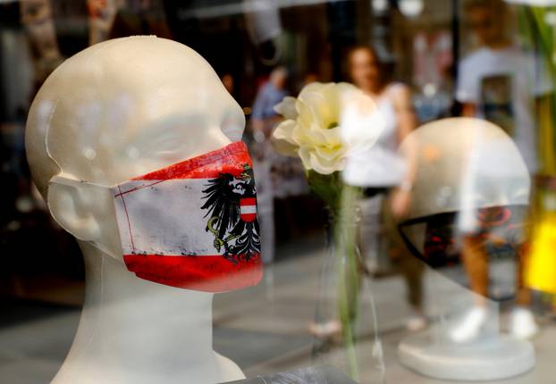 Protecitive face masks are on display in a shop in Vienna