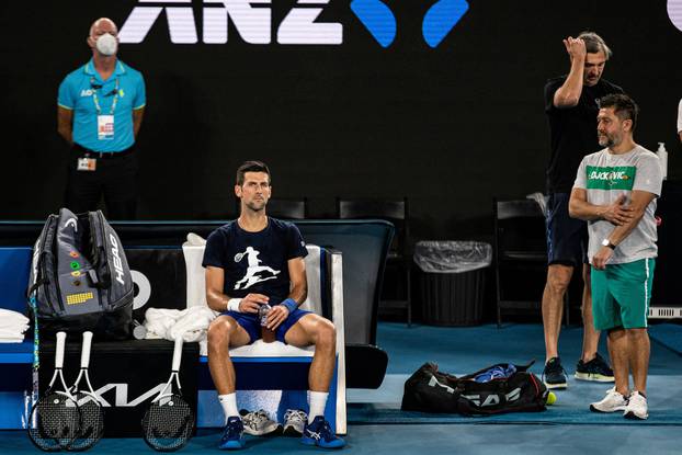 Serbian tennis player Novak Djokovic rests during a training session at Melbourne Park