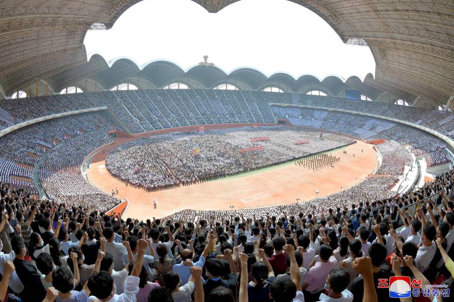 People attend a mass rally denouncing the U.S. in Pyongyang
