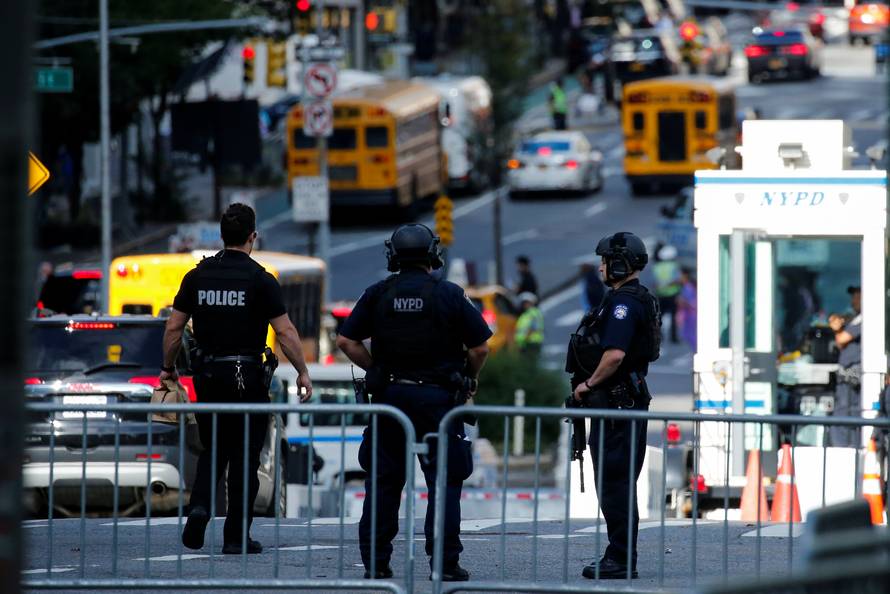 New York Police officers stand guard near the UN building where heads of state and officials are attending the 73rd session of the United Nations General Assembly at U.N. headquarters in New York