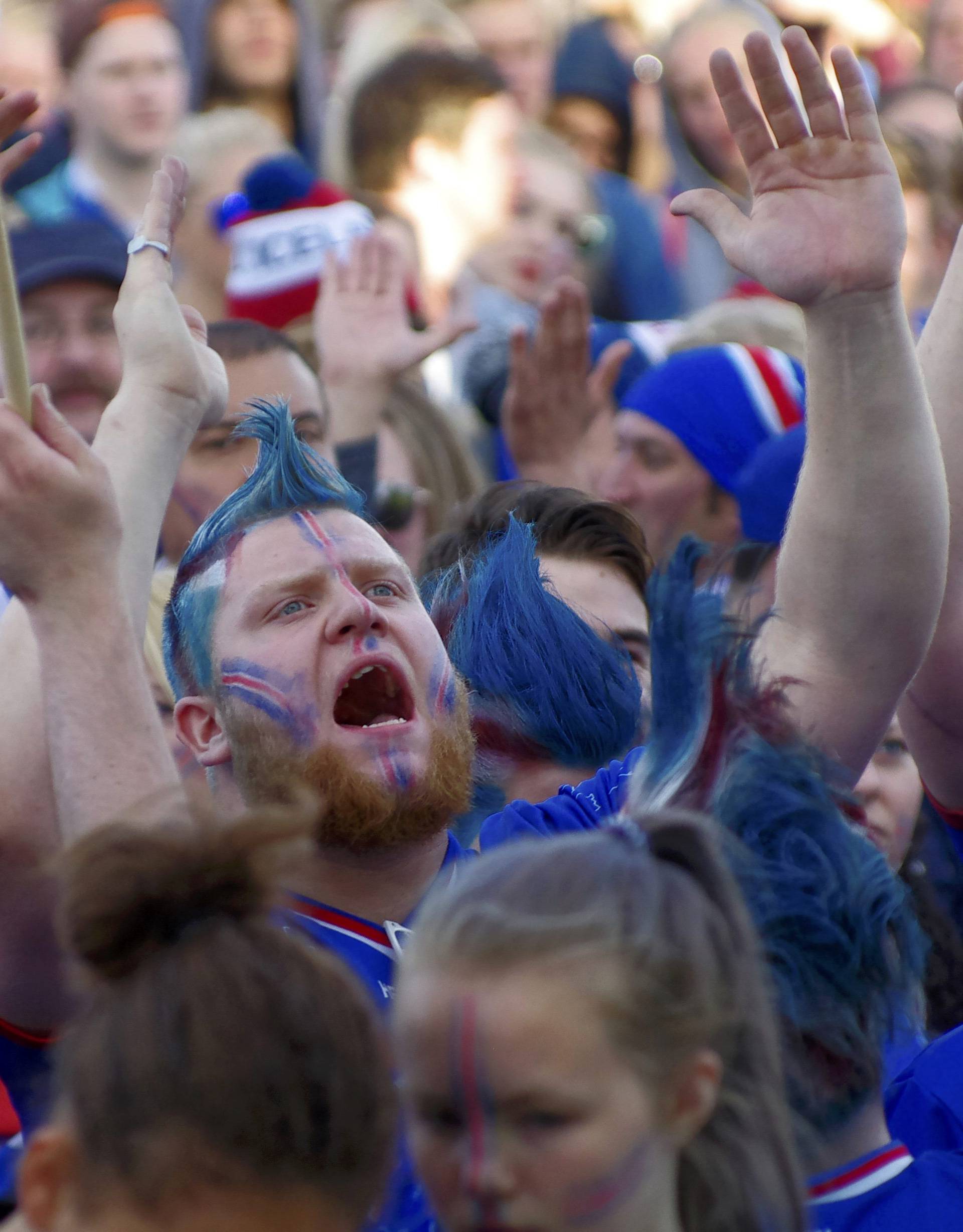 Fans of Iceland react as they watch the Euro 2016 match between Iceland and France in France, at a public screening in Reykjavik