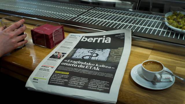 Basque language newspaper Berria displays a photograph with the symbol of armed Basque separatists ETA following groups apology, in Bilbao