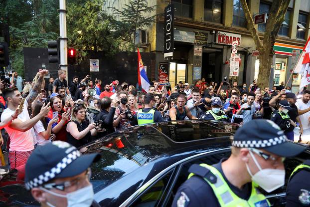 Supporters of Serbian tennis player Novak Djokovic rally in the street, in Melbourne