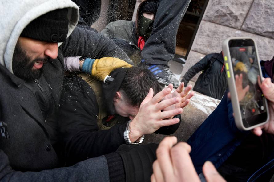 People attend the "March Against Minnesota Fraud" in Minneapolis