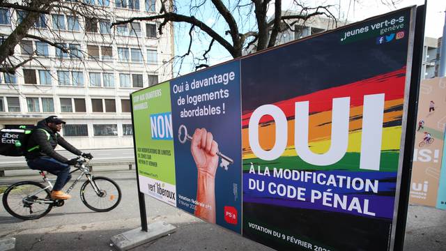A poster in favour of the change of the penal code is pictured ahead of a referendum on anti-homophobia law in Geneva