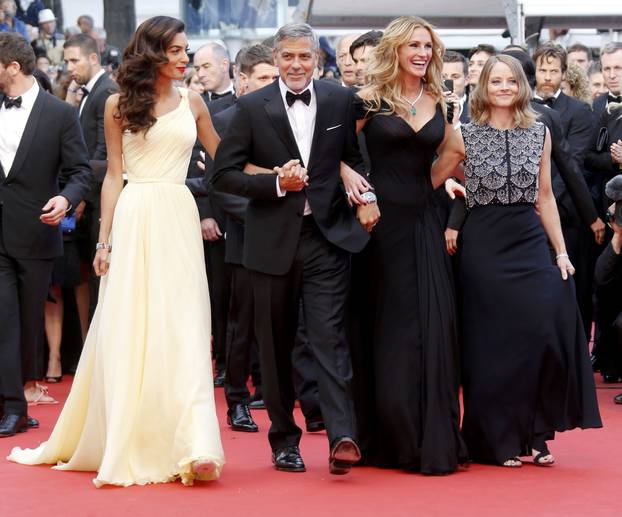 Cast member Geroge Clooney and his wife Amal, actress Julia Roberts and director Jodie Foster arrive for the screening of the film "Money Monster" out of competition during the 69th Cannes Film Festival in Cannes