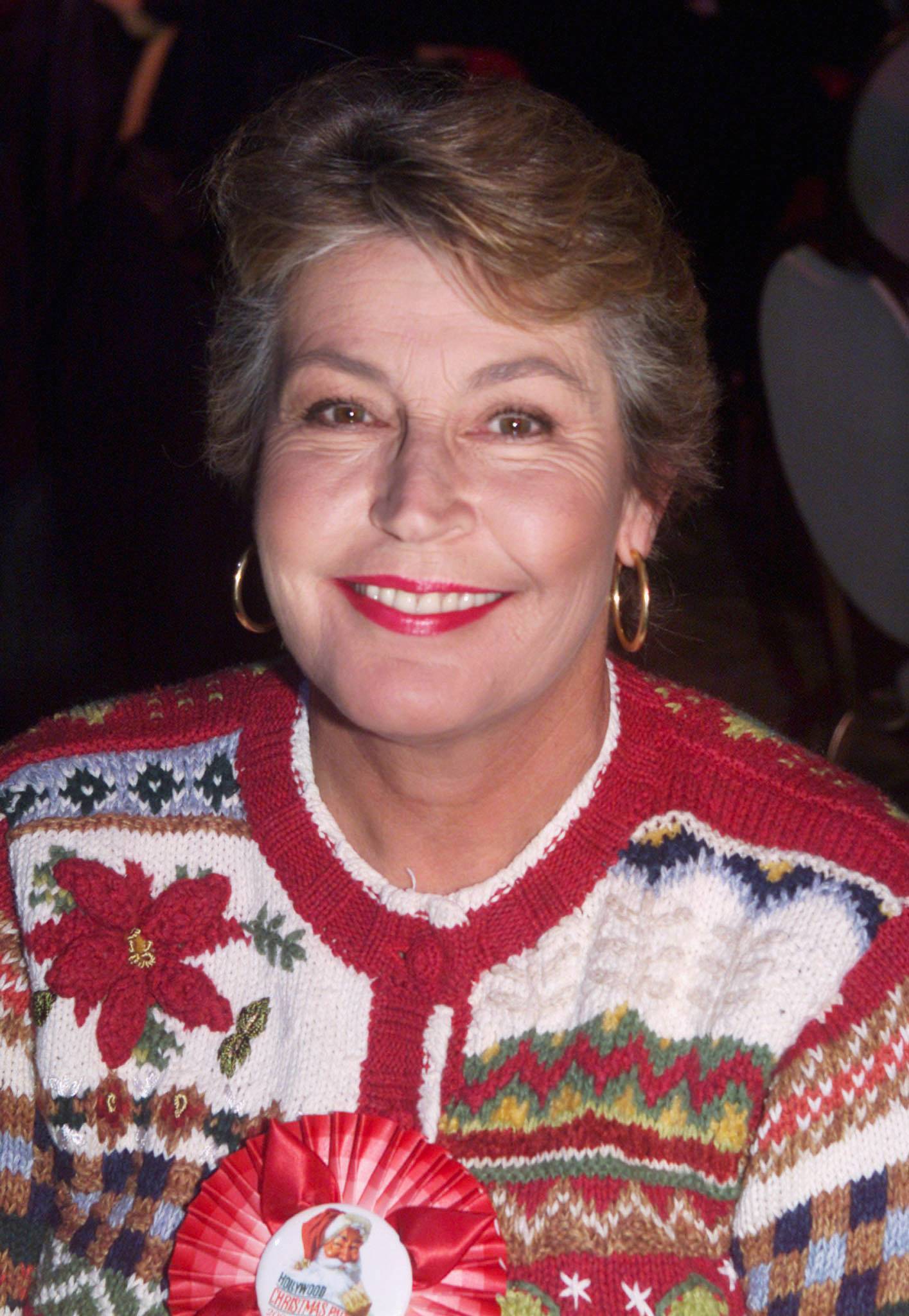 FILE PHOTO: Singer Helen Reddy poses in the VIP reception room at the 69th annual Hollywood Christmas Parade November 26, 2000 in Hollywood
