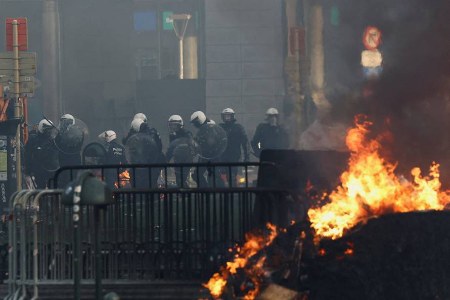 Farmers rally in a large-scale protest in Brussels as leaders meet in EU summit