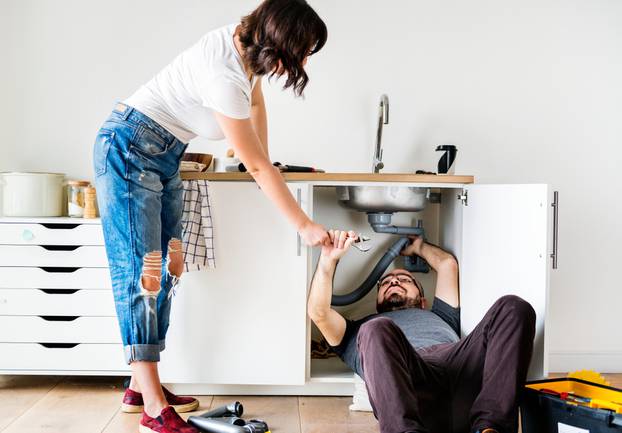 Couple,Fixing,Kitchen,Sink