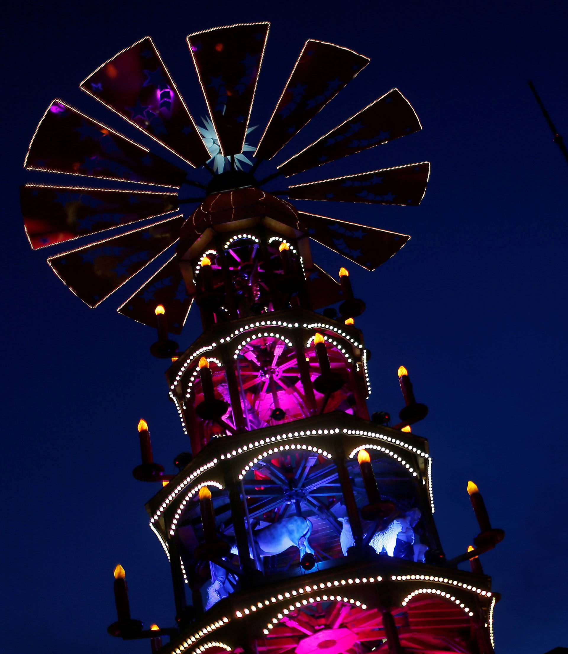 A Christmas pyramid is pictured next to the television tower at the Christmas market at Alexanderplatz square in Berlin