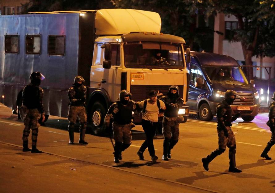 Clashes with opposition supporters after polls closed at the presidential election in Minsk