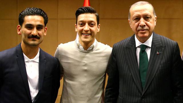 FILE PHOTO: Turkish President Erdogan meets with Premier League soccer players Gundogan of Manchester City, Ozil of Arsenal and Tosun of Everton in London