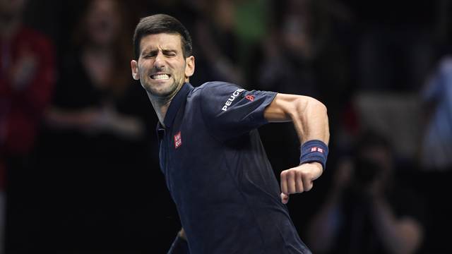 Serbia's Novak Djokovic celebrates winning his round robin match with Austria's Dominic Thiem