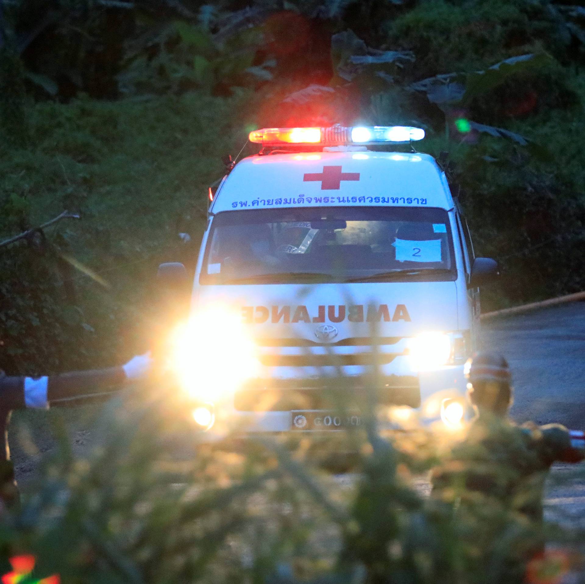 An ambulance leaves from Tham Luang cave complex in the northern province of Chiang Rai