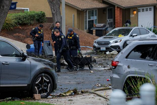 Crash scene after a civilian aircraft went down in a military neighborhood, in San Diego
