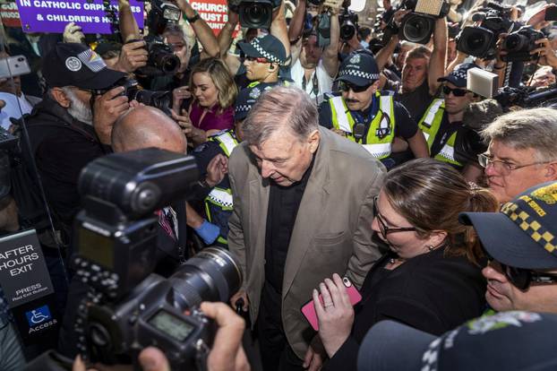 Cardinal George Pell arrives at County Court in Melbourne