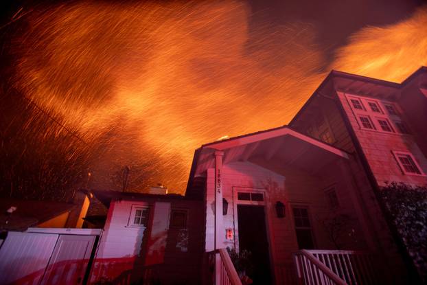 Palisades fire burns during a windstorm on the west side of Los Angeles