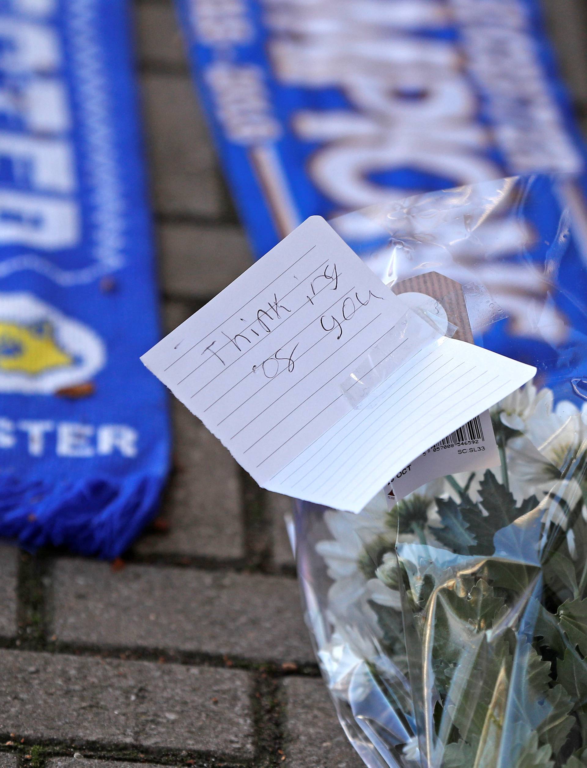 Messages and flowers can be seen placed outside Leicester City football stadium after the helicopter of the club owner Thai businessman Vichai Srivaddhanaprabha crashed when leaving the ground on Saturday evening after the match, in Leicester