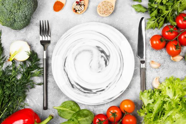Concept dietary and vegetable food. Plate with marble patterns. 