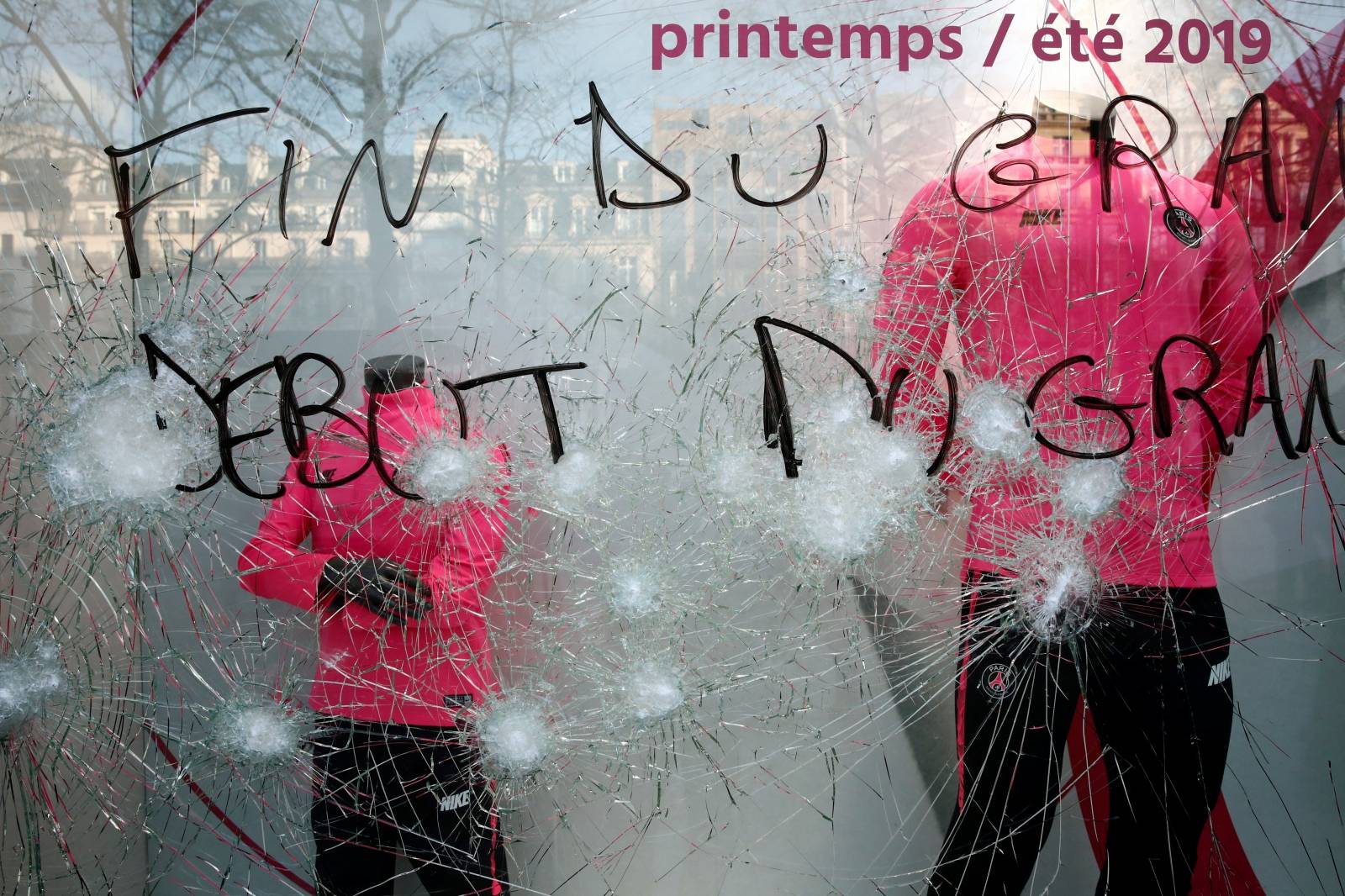 The damaged window of the Paris Saint-Germain shop is pictured on the Champs-Elysees after a demonstration by the "yellow vests" movement in Paris