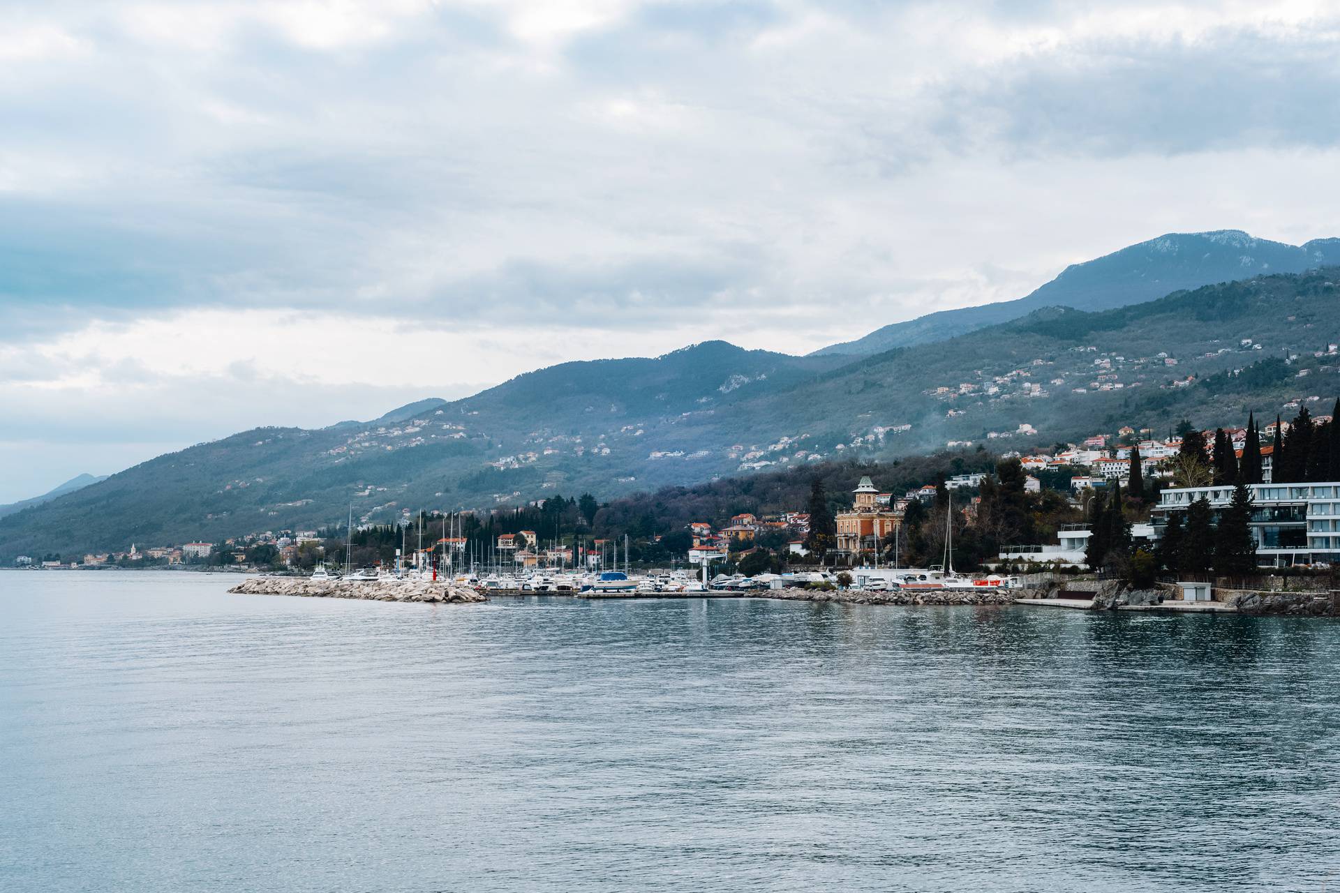 Seafront of Opatija town, Croatia. Beautiful view of the mountains on the background