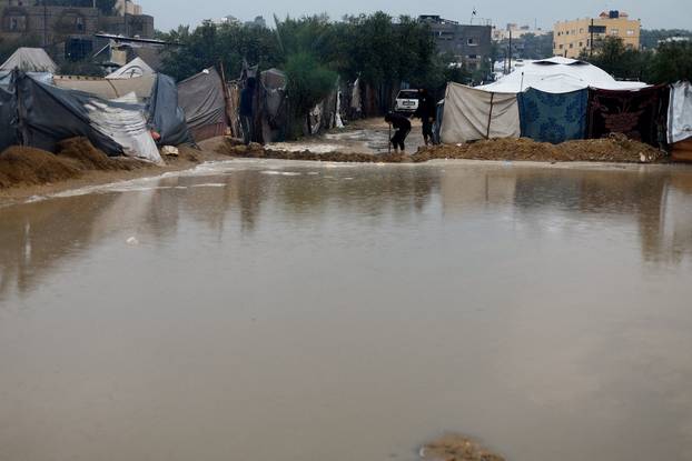 Displaced Palestinians shelter in a tent camp in Nuseirat