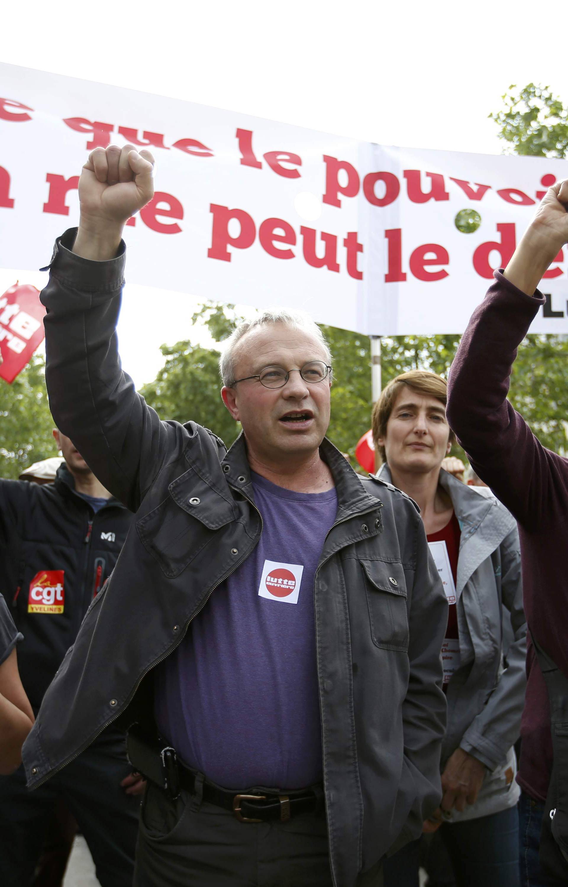  French labour union members march during a demonstration in protest of the government's proposed labor law reforms in Paris